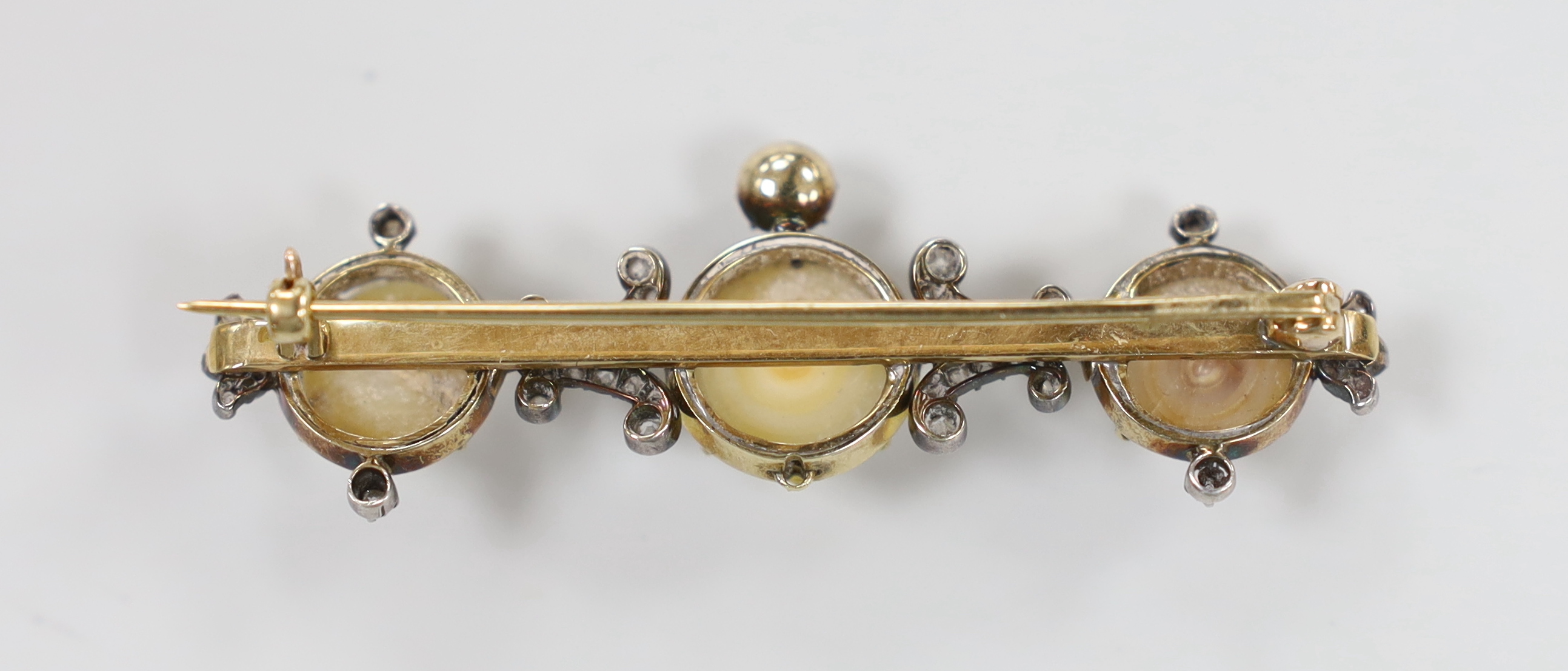 A late Victorian gold and silver, diamond and three stone half pearl set cluster bar brooch